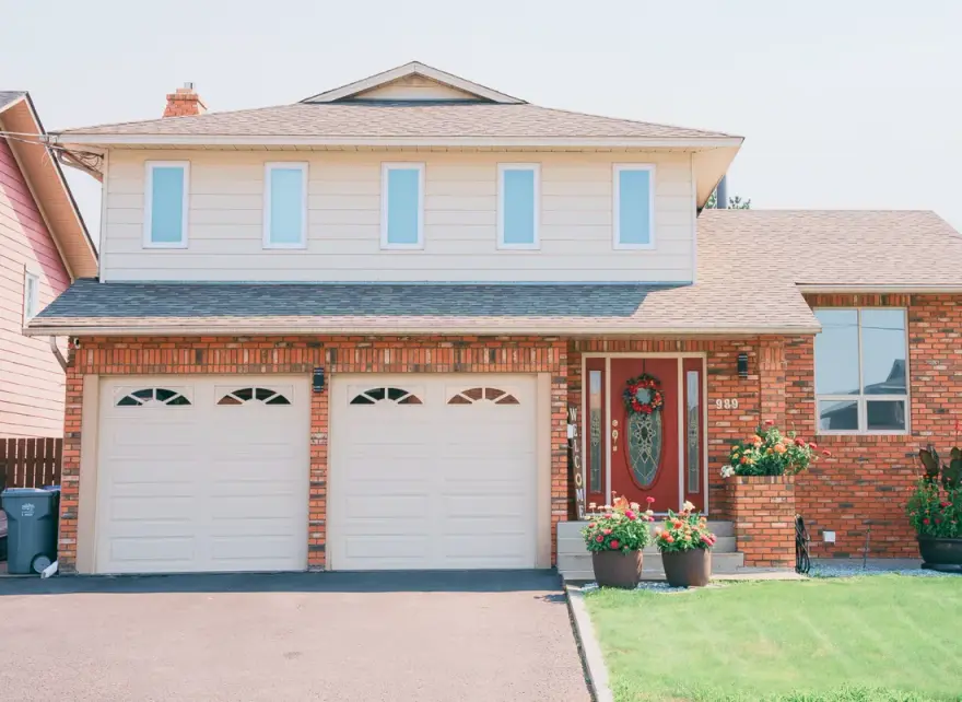 New windows and front door installed on a two-story Alberta home